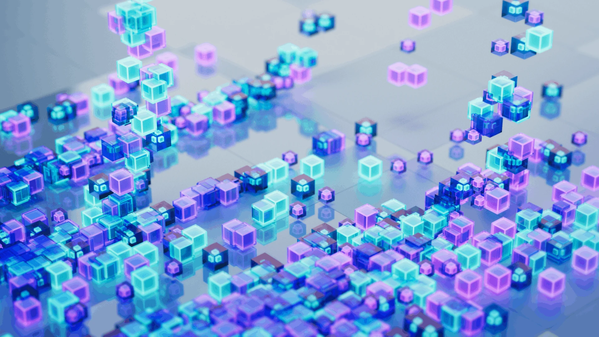 Clusters of cyan and violet glass-like cubes across a pale surface