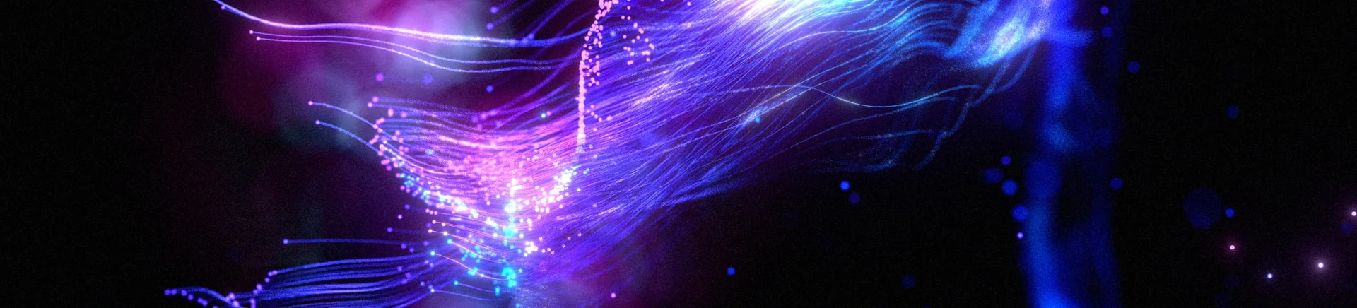 A luminous violet particle form in a panoramic frame